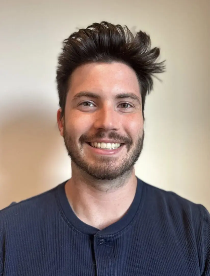 A man with a beard and messy hair.