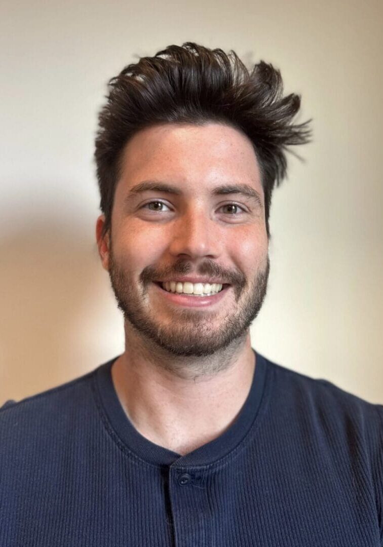 A man with a beard and messy hair.